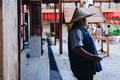 Lhong 1919, a staff with traditional chinese hat